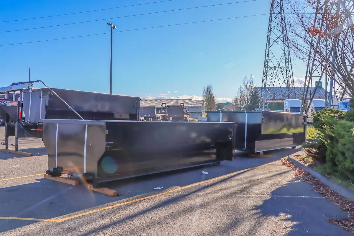 Roll-off dumpster ready for waste disposal at job site for Concrete Dumpster Rental in Fairwood
